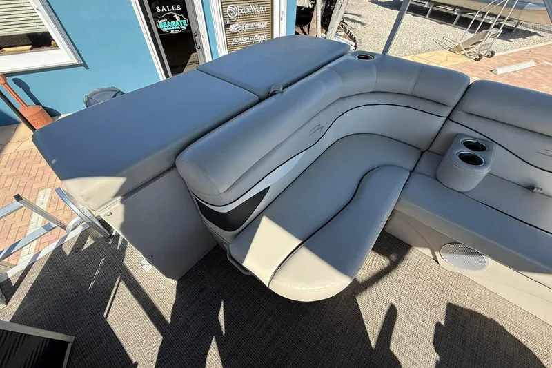 Slide: The Image of 2019 Bennington 188 SLV boat interior with gray seating and cup holders. - 16