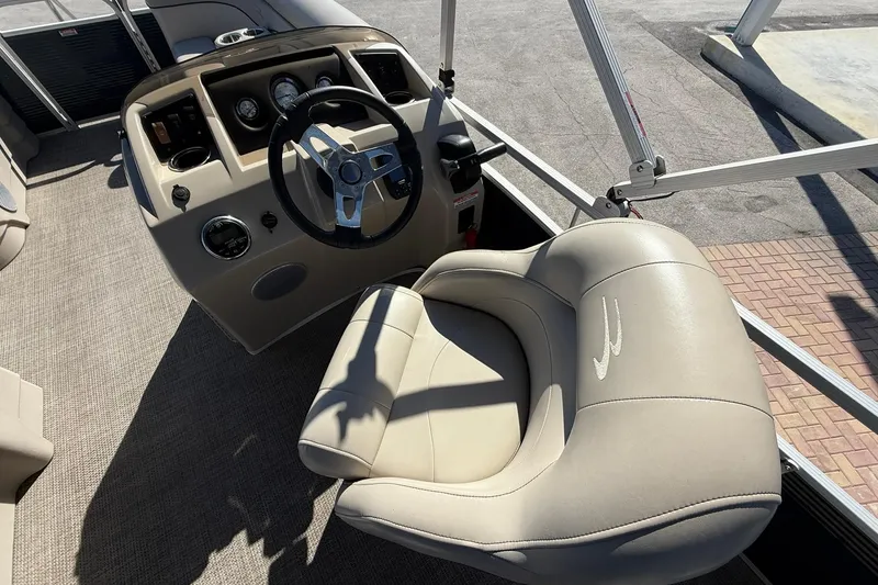 Slide: The Image of 2019 Bennington 188 SLV boat interior with steering wheel and plush seating. - 18
