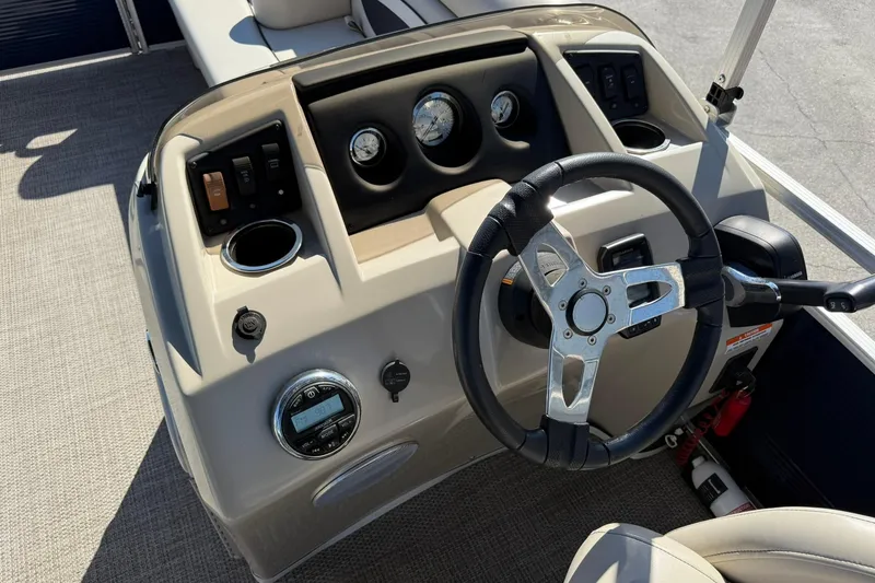 Slide: The Image of 2019 Bennington 188 SLV boat dashboard with steering wheel and control panel. - 20