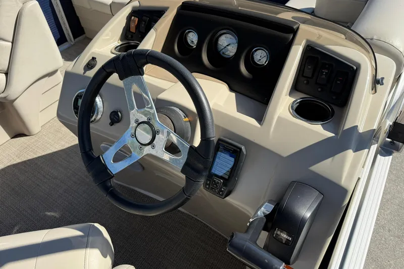 Slide: The Image of 2019 Bennington 188 SLV boat dashboard with steering wheel and control panel. - 21