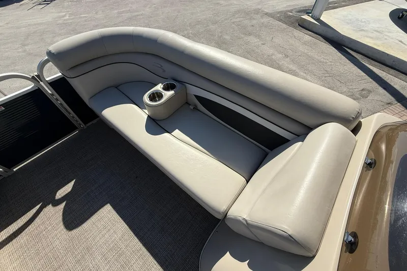 Slide: The Image of 2019 Bennington 188 SLV boat interior with beige seating and cup holders. - 26