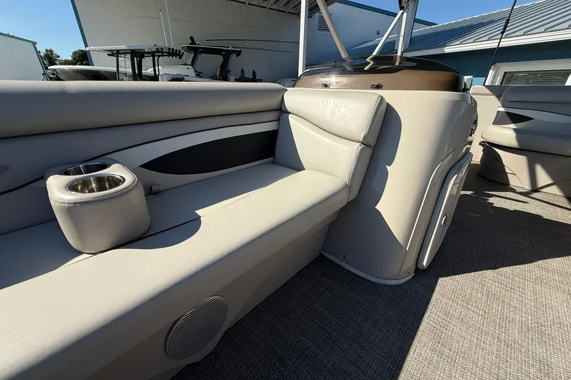 Slide: The Image of 2019 Bennington 188 SLV boat interior with beige seating and cup holders. - 27