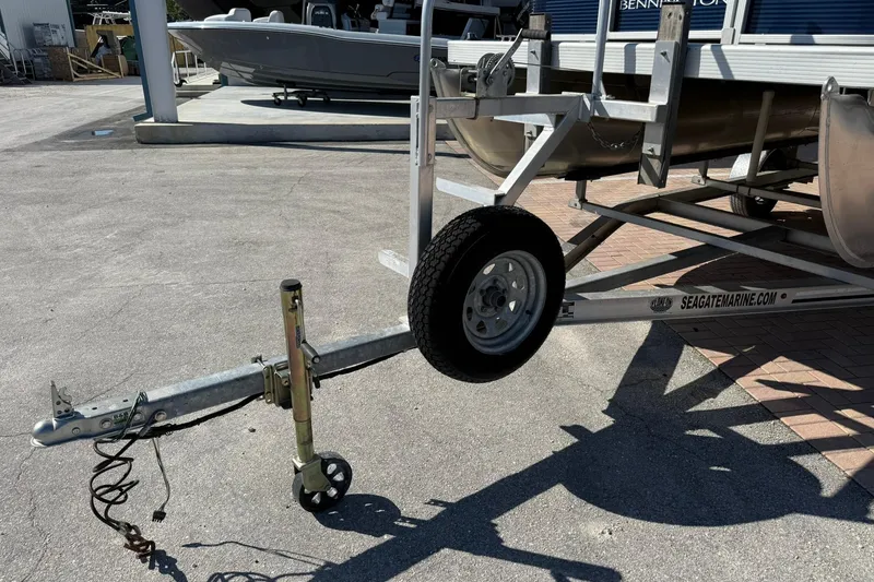 Slide: The Image of 2019 Bennington 188 SLV boat trailer parked on concrete surface. - 28