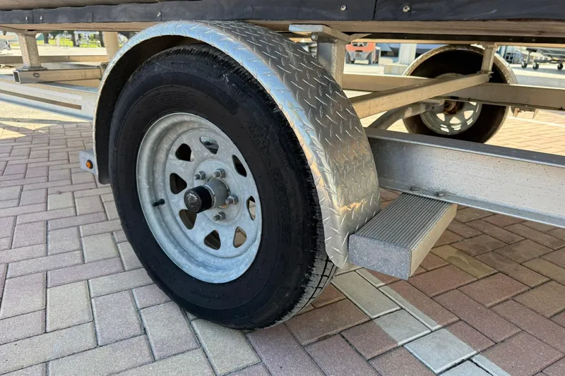 Slide: The Image of Trailer wheel and fender of a 2019 Bennington 188 SLV on brick pavement. - 31