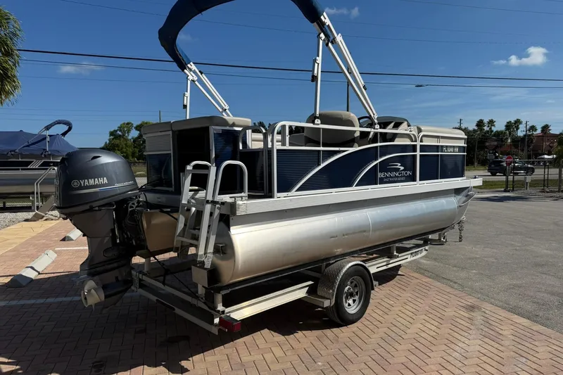 Slide: The Image of 2019 Bennington 188 SLV pontoon boat with Yamaha motor on a trailer. - 7