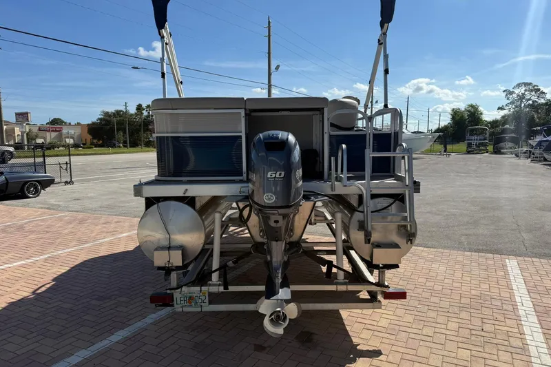 Slide: The Image of 2019 Bennington 188 SLV pontoon boat with Yamaha 60 HP engine, parked on a sunny day. - 9