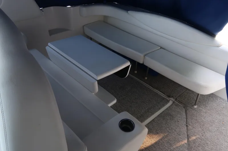 Slide: The Image of 2002 Sea Ray 410 Sundancer interior with white seating and table. - 18