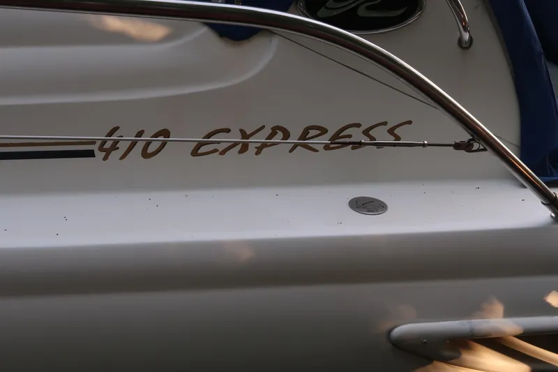 Slide: The Image of 2002 Sea Ray 410 Sundancer boat with "410 Express" lettering on the side. - 24
