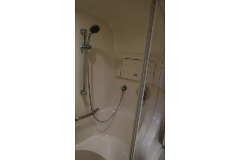 Slide: The Image of Shower area in 2002 Sea Ray 410 Sundancer yacht, featuring modern fixtures. - 31