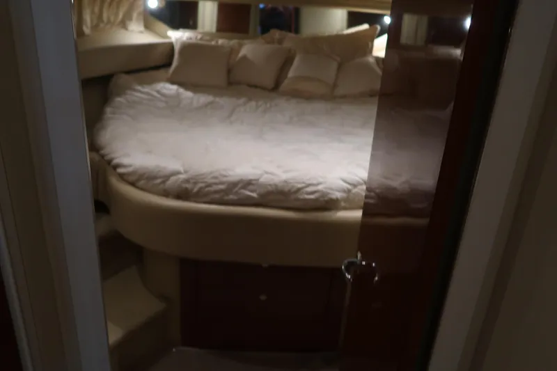 Slide: The Image of Luxurious cabin interior of 2002 Sea Ray 410 Sundancer yacht with cozy bedding. - 33