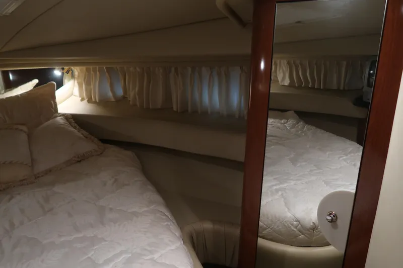 Slide: The Image of Luxurious cabin interior of 2002 Sea Ray 410 Sundancer yacht with cozy bedding. - 34