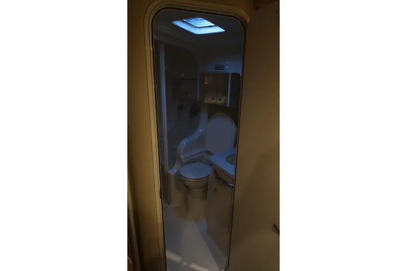 Slide: The Image of Bathroom interior of 2002 Sea Ray 410 Sundancer yacht with skylight. - 36