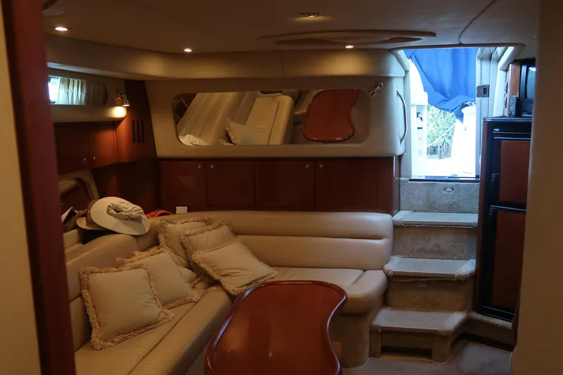 Slide: The Image of Luxurious interior of 2002 Sea Ray 410 Sundancer yacht with plush seating and elegant decor. - 37