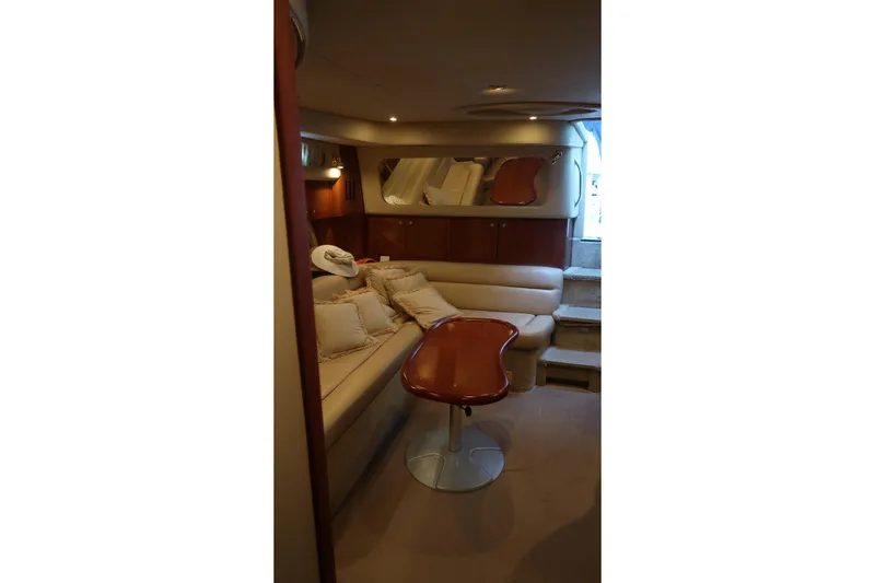 Slide: The Image of Luxurious interior of 2002 Sea Ray 410 Sundancer yacht with plush seating and elegant design. - 38
