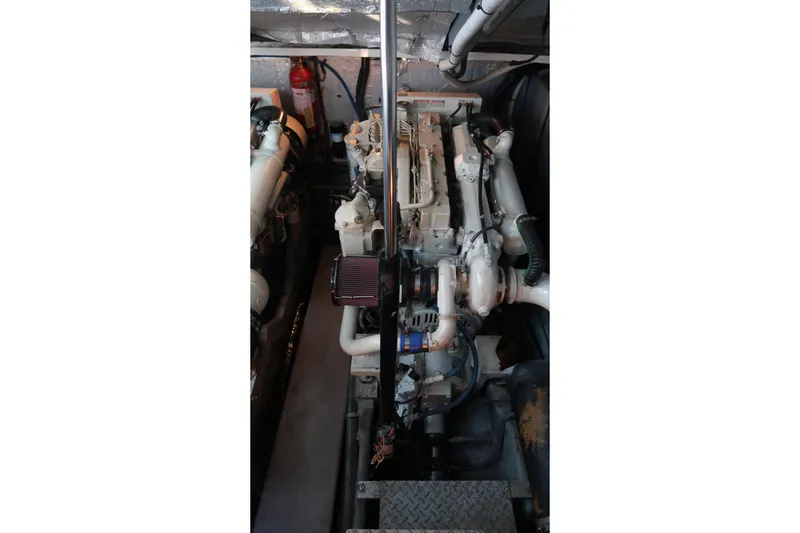 Slide: The Image of Engine compartment of a 2002 Sea Ray 410 Sundancer boat, showcasing mechanical components. - 40