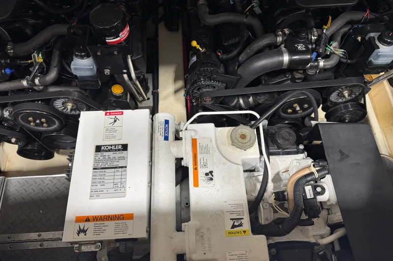 Slide: The Image of Engine compartment of a 2005 Formula 330 Sun Sport boat with visible Kohler generator. - 15
