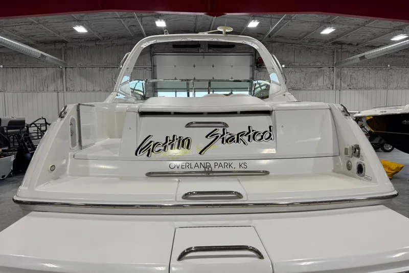 Slide: The Image of 2005 Formula 330 Sun Sport boat in a garage, labeled "Gettin Started," Overland Park, KS. - 5