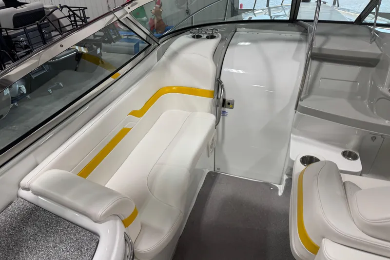Slide: The Image of 2005 Formula 330 Sun Sport boat interior with white and yellow seating, cup holders, and sleek design. - 9