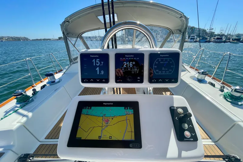 Slide: The Image of Cockpit of 2003 Beneteau First 47.7 sailboat with navigation instruments and controls. - 17