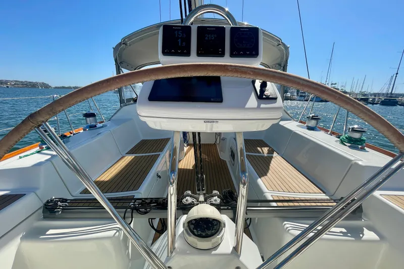 Slide: The Image of Cockpit view of 2003 Beneteau First 47.7 sailboat with steering wheel and navigation instruments. - 18