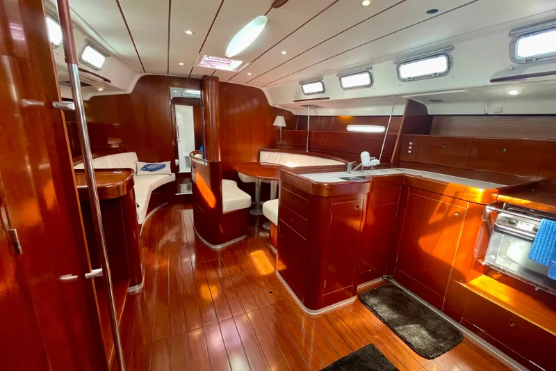 Slide: The Image of Luxurious interior of 2003 Beneteau First 47.7 yacht with polished wood finish. - 23