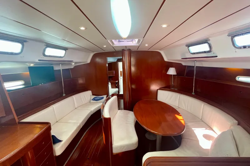 Slide: The Image of Luxurious interior of 2003 Beneteau First 47.7 yacht with elegant wood finish. - 24