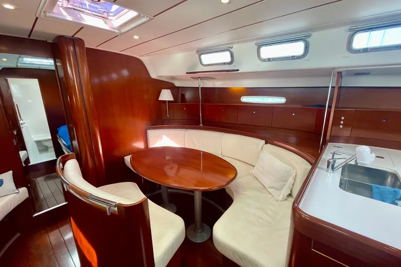 Slide: The Image of Luxurious interior of 2003 Beneteau First 47.7 yacht with elegant wood finish. - 27