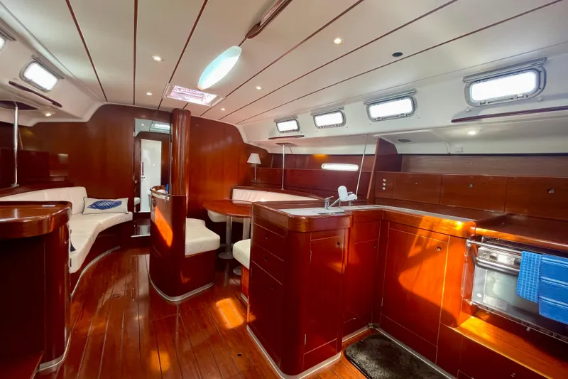 Slide: The Image of Luxurious interior of 2003 Beneteau First 47.7 yacht with polished wood and modern amenities. - 30