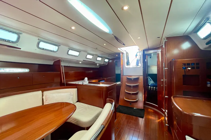 Slide: The Image of Luxurious interior of 2003 Beneteau First 47.7 sailboat with elegant wood finish. - 31