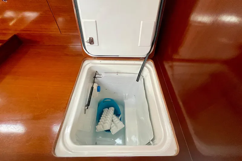 Slide: The Image of Open storage compartment on 2003 Beneteau First 47.7 yacht with ice tray inside. - 37