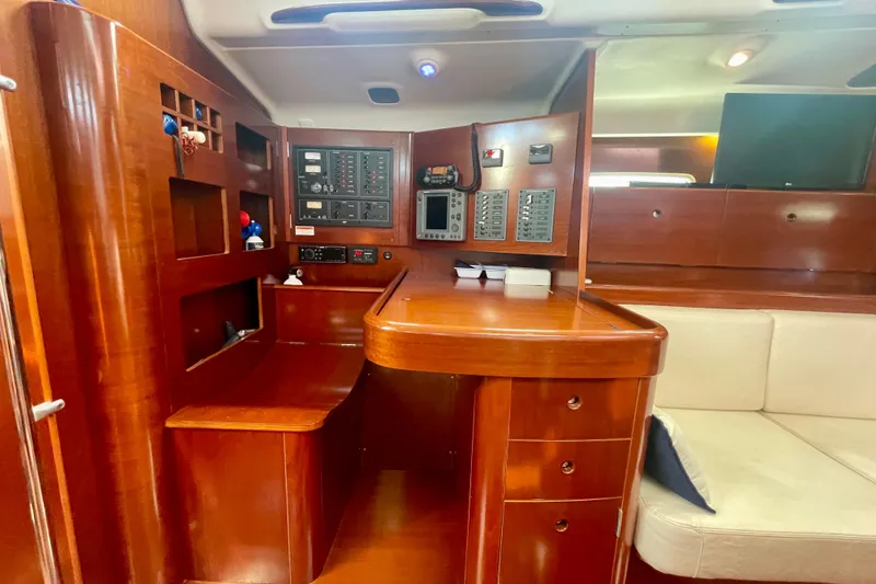 Slide: The Image of Luxurious interior of 2003 Beneteau First 47.7 sailboat with navigation station. - 39