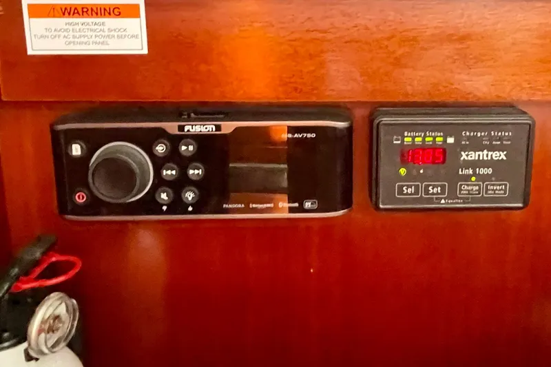 Slide: The Image of Control panel on a 2003 Beneteau First 47.7 yacht with Fusion and Xantrex systems. - 42