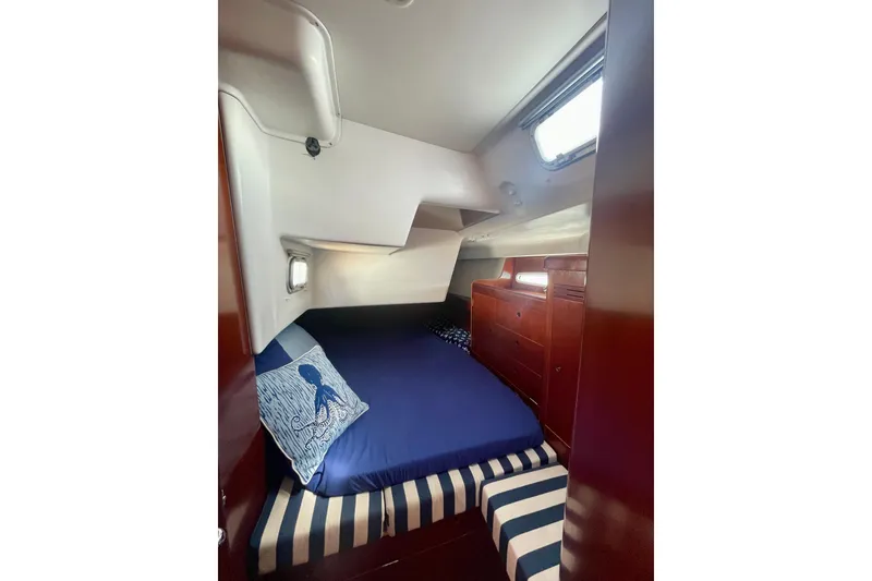 Slide: The Image of Cozy cabin interior of 2003 Beneteau First 47.7 sailboat with nautical decor. - 44