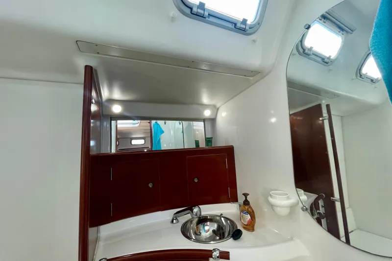 Slide: The Image of Bathroom interior of 2003 Beneteau First 47.7 yacht with sink and mirror. - 47