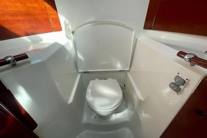 Slide: The Image of Beneteau First 47.7 2003 yacht bathroom with modern fixtures and wooden accents. - 53