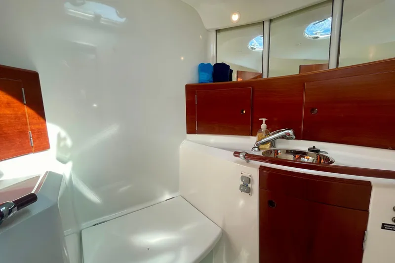 Slide: The Image of Luxurious bathroom interior of 2003 Beneteau First 47.7 yacht with wooden cabinetry. - 54