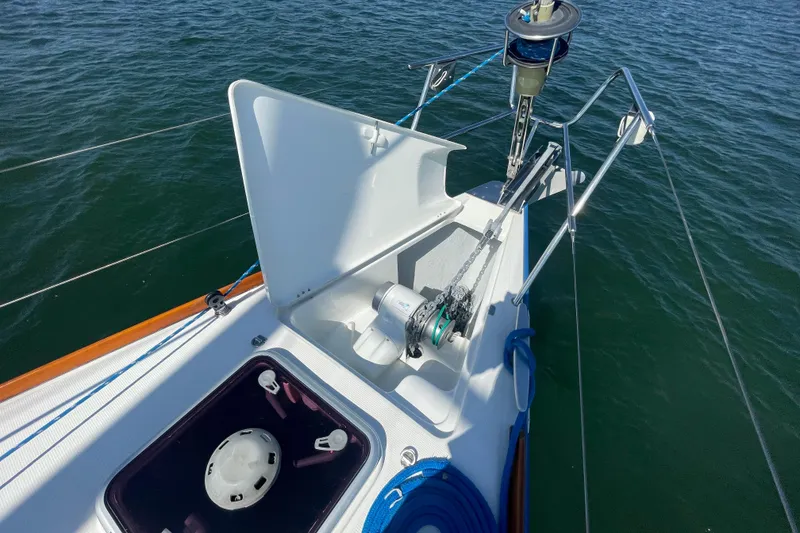 Slide: The Image of Bow of 2003 Beneteau First 47.7 sailboat with anchor chain and winch system. - 7