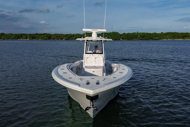 Slide: The Image of 2026 Yellowfin 36 Offshore boat on calm water, front view. - 108