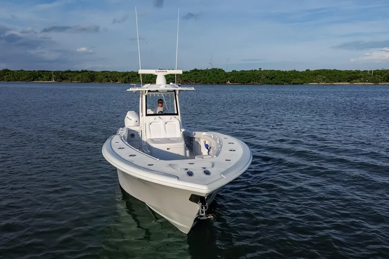 Slide: The Image of 2026 Yellowfin 36 Offshore boat on calm water, clear sky background. - 109