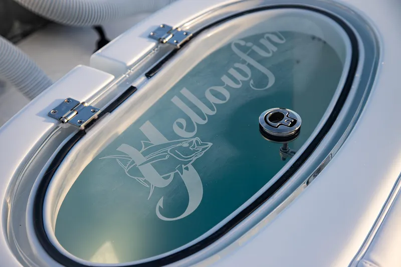 Slide: The Image of 2026 Yellowfin 36 Offshore boat livewell with logo and secure latch. - 11