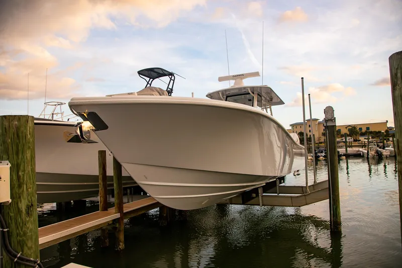 Slide: The Image of 2026 Yellowfin 36 Offshore boat docked at marina during sunset. - 110
