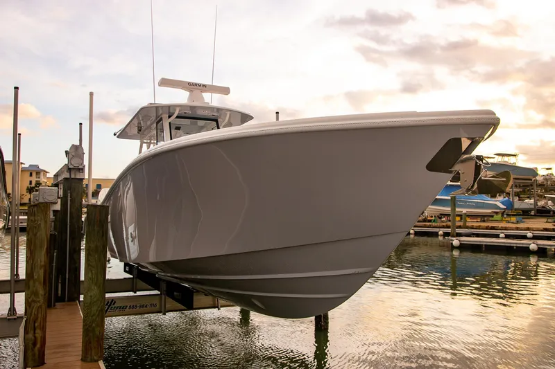 Slide: The Image of 2026 Yellowfin 36 Offshore boat docked at marina during sunset. - 111