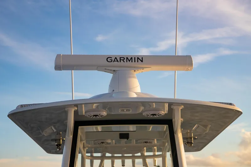 Slide: The Image of 2026 Yellowfin 36 Offshore boat with Garmin radar against blue sky. - 114