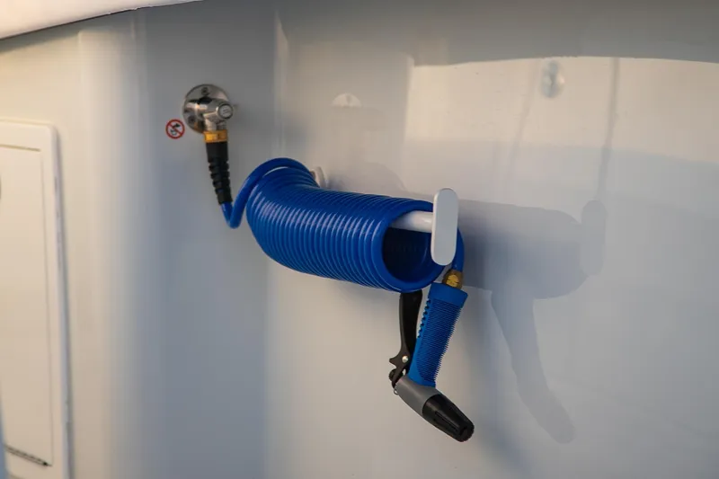 Slide: The Image of Blue coiled hose on 2026 Yellowfin 36 Offshore boat. - 115