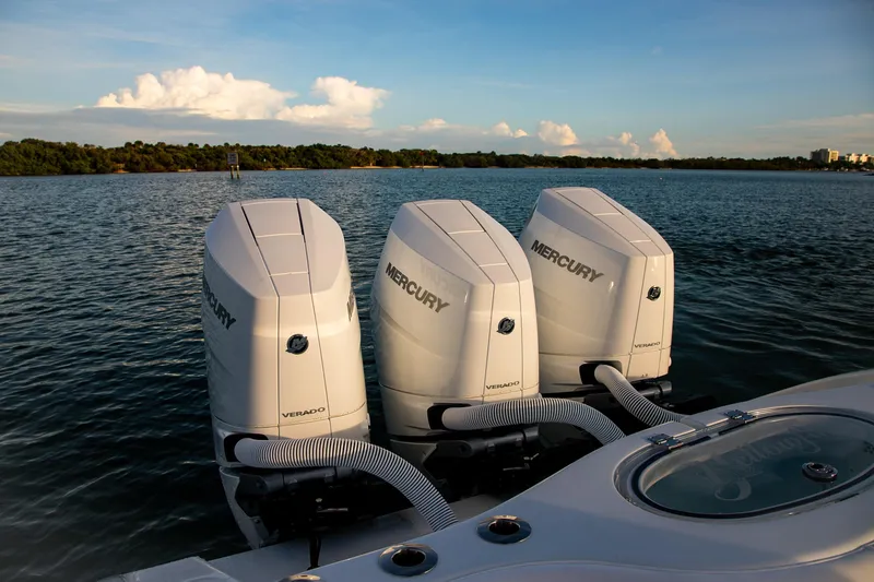 Slide: The Image of 2026 Yellowfin 36 Offshore boat with triple Mercury Verado engines on a serene water backdrop. - 12