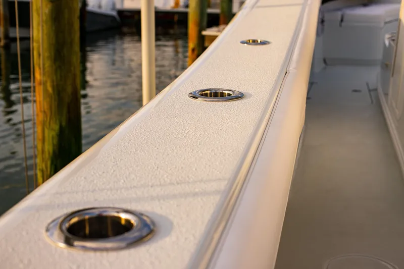Slide: The Image of 2026 Yellowfin 36 Offshore boat deck with rod holders, docked at marina. - 122
