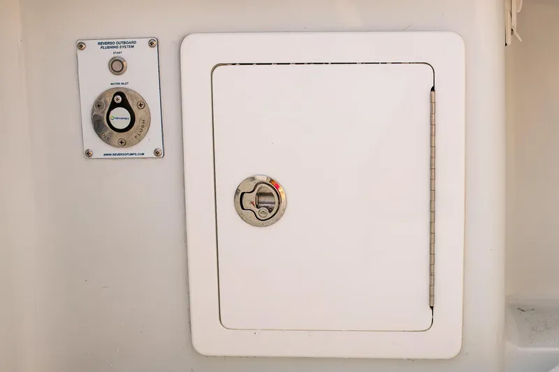 Slide: The Image of 2026 Yellowfin 36 Offshore boat compartment with Reverso outboard flushing system. - 124