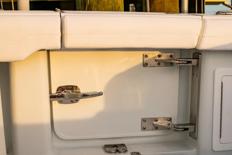 Slide: The Image of 2026 Yellowfin 36 Offshore boat door with stainless steel hinges and latch. - 125