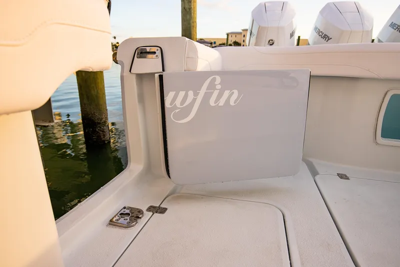 Slide: The Image of 2026 Yellowfin 36 Offshore boat interior with Mercury engines in background. - 126