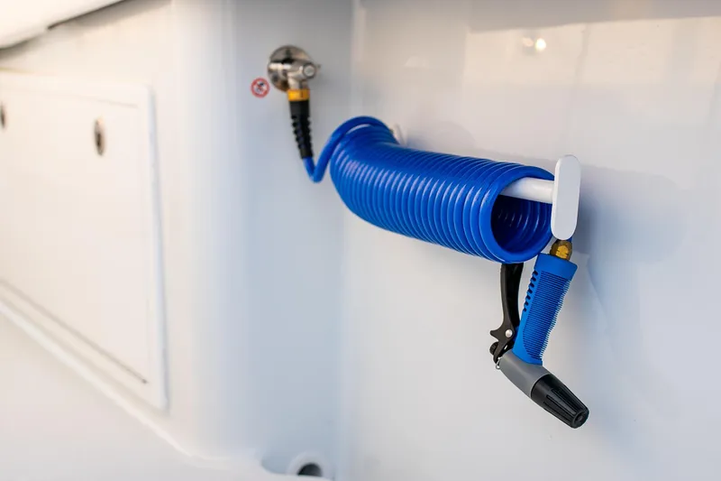 Slide: The Image of Blue coiled hose on 2026 Yellowfin 36 Offshore boat. - 133